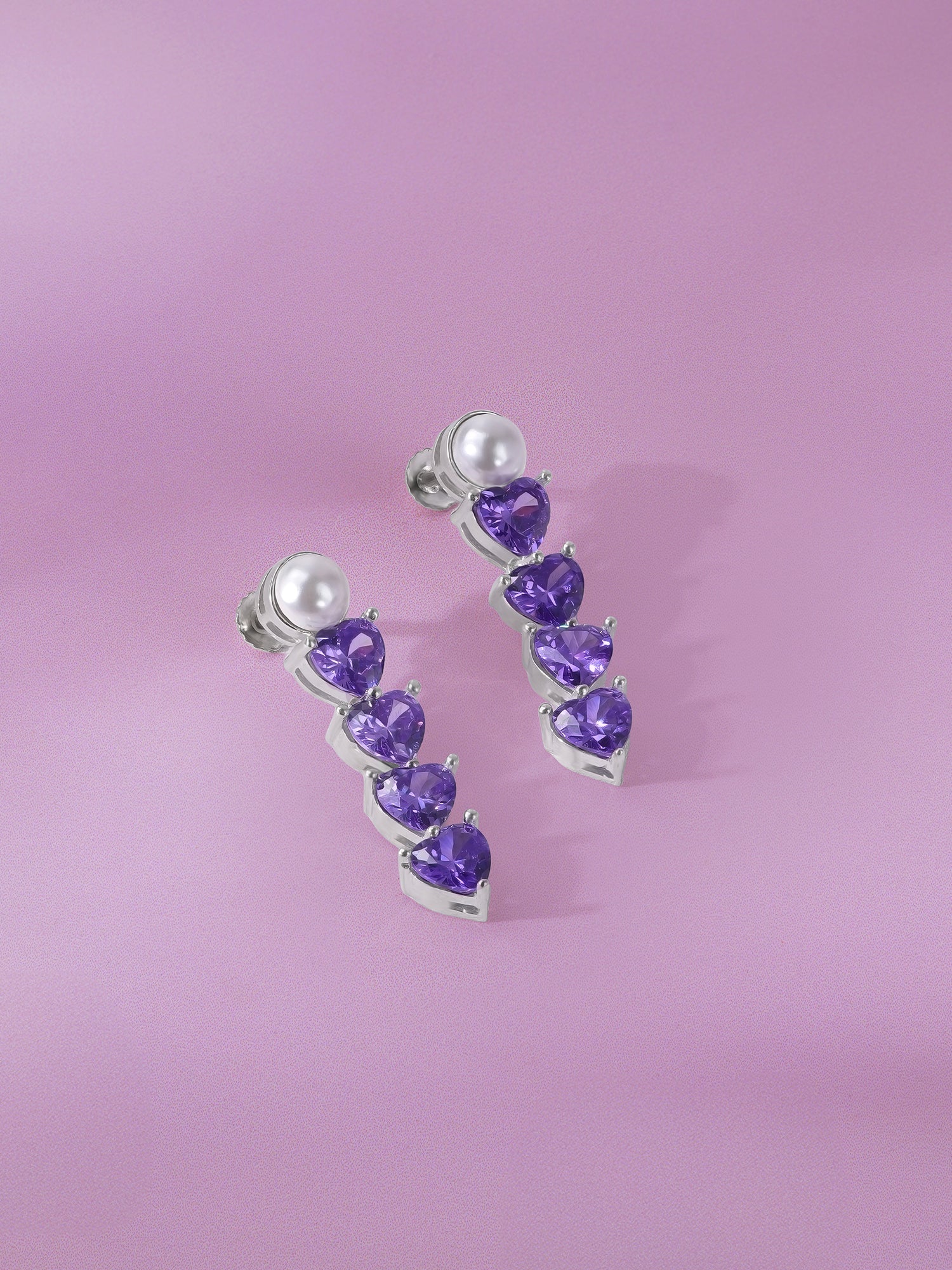 Detailed close up of SIJA 925 Silver Heart Stone Drop Earrings showing sparkling heart shaped stone and handcrafted silver finish