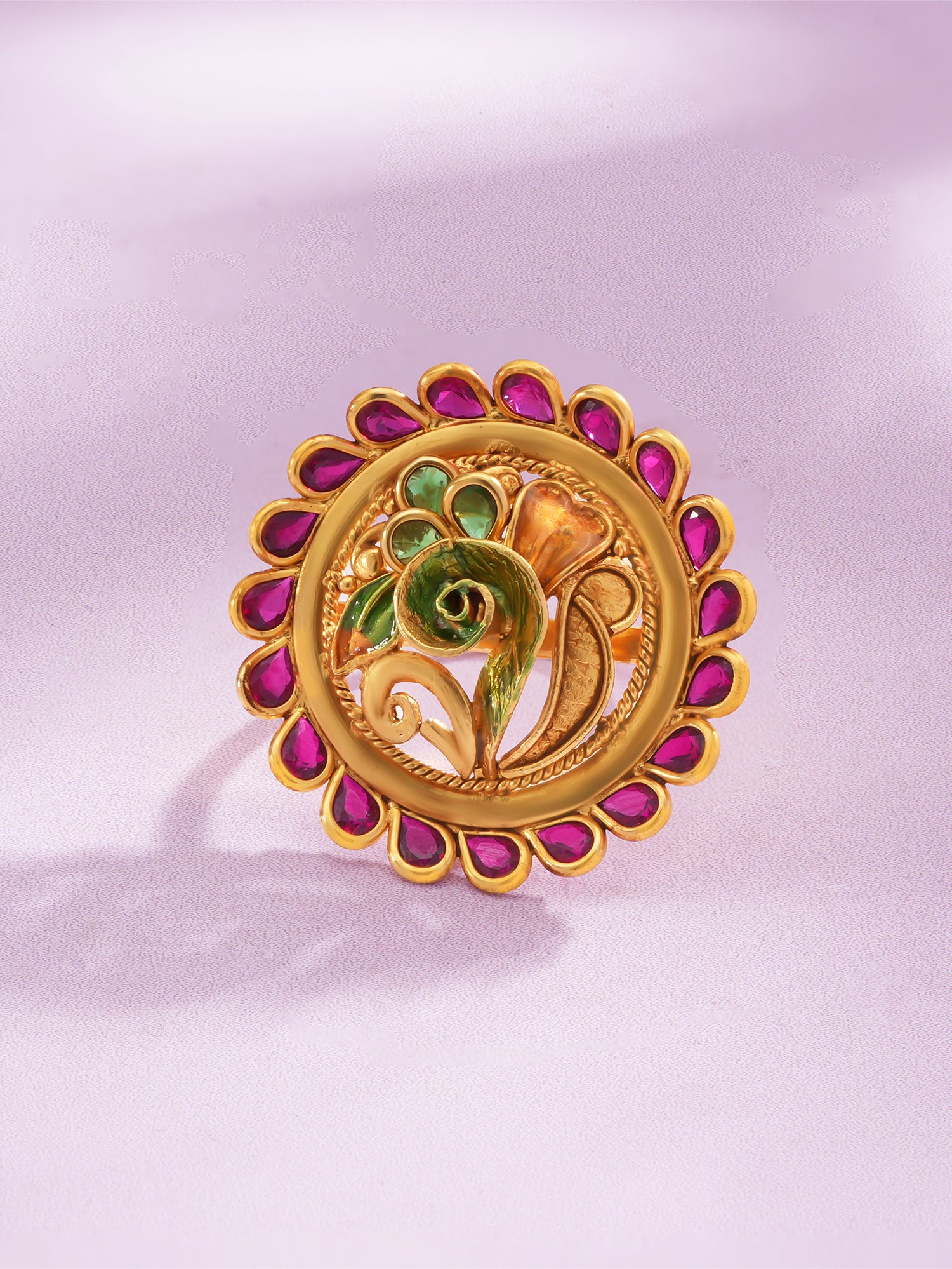 Detailed close up of SIJA Antique Ruby Peacock Ring showing ruby stone accents and gold plated peacock design