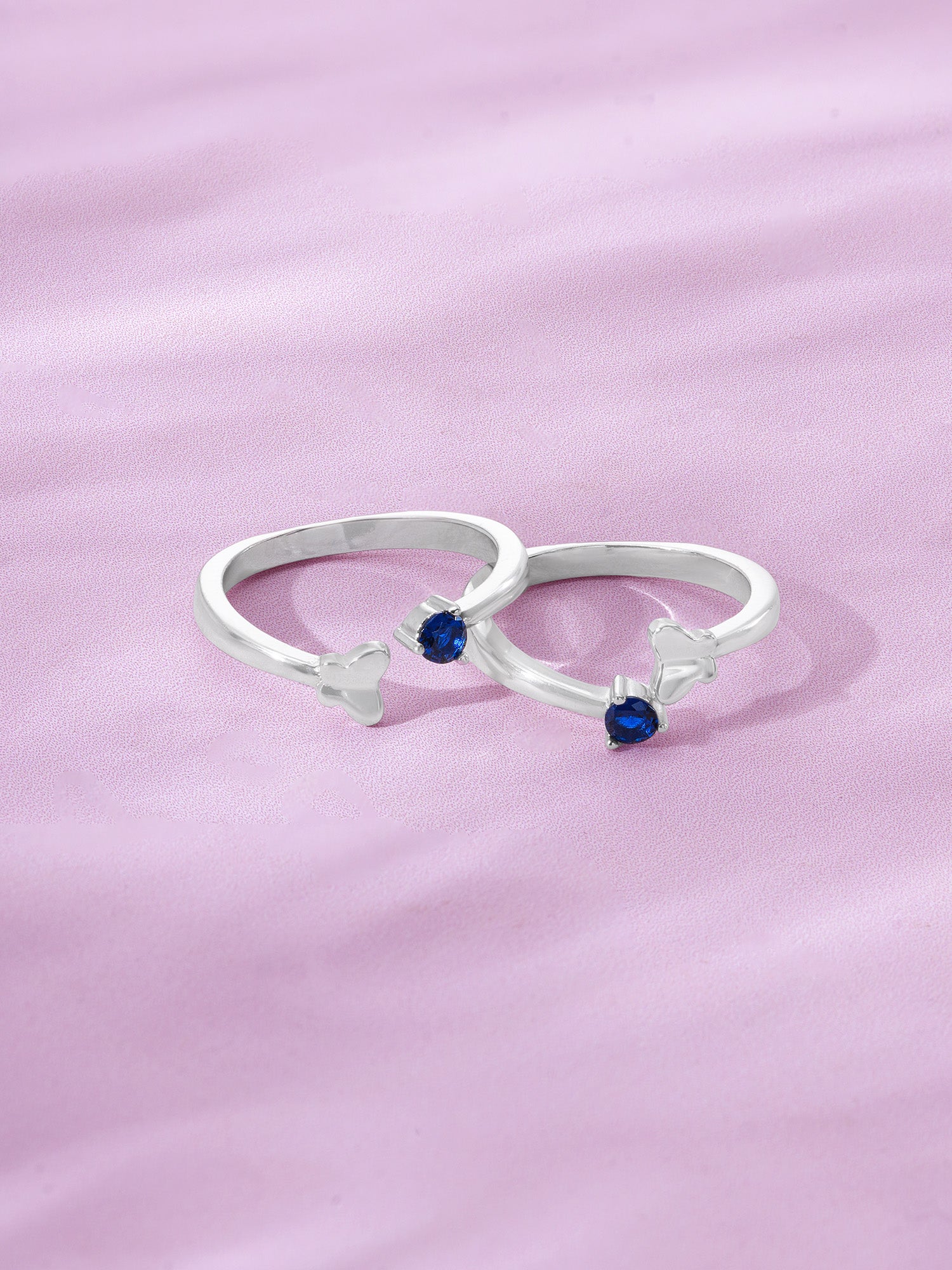 Detailed close up of SIJA 925 Silver Blue Stone Butterfly Toe Ring showing butterfly motif with sparkling blue stone accents handcrafted in silver