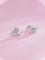 Detailed close up of SIJA 925 Silver Bow Heart Stud showing delicate bow with heart motif and handcrafted silver finish