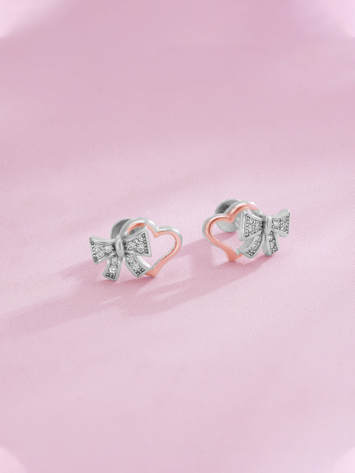 Detailed close up of SIJA 925 Silver Bow Heart Stud showing delicate bow with heart motif and handcrafted silver finish