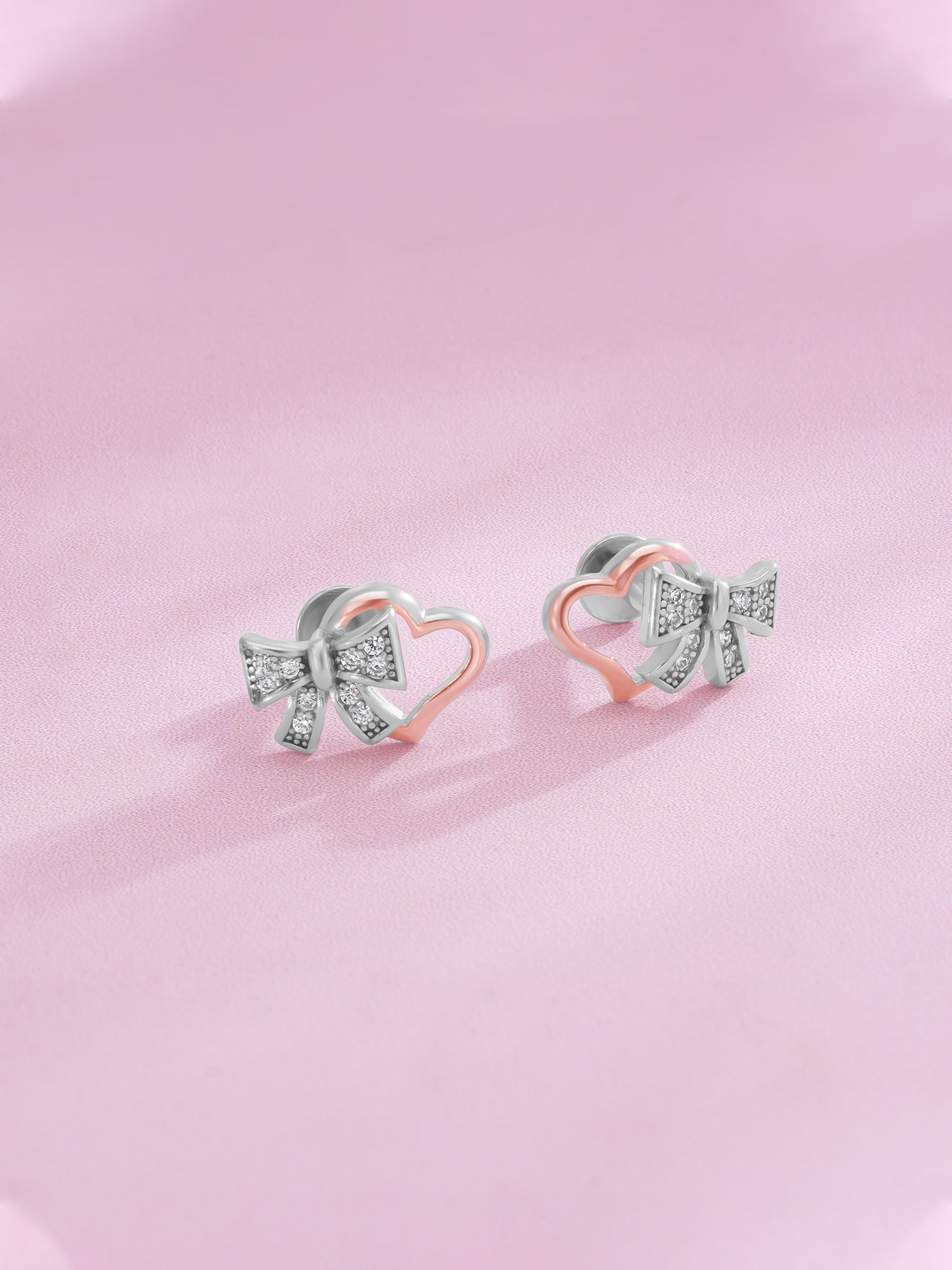 Detailed close up of SIJA 925 Silver Bow Heart Stud showing delicate bow with heart motif and handcrafted silver finish