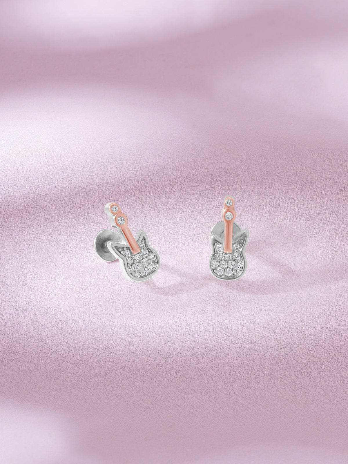 Detailed close up of SIJA 925 Silver Guitar Stud showing miniature guitar design and handcrafted silver finish