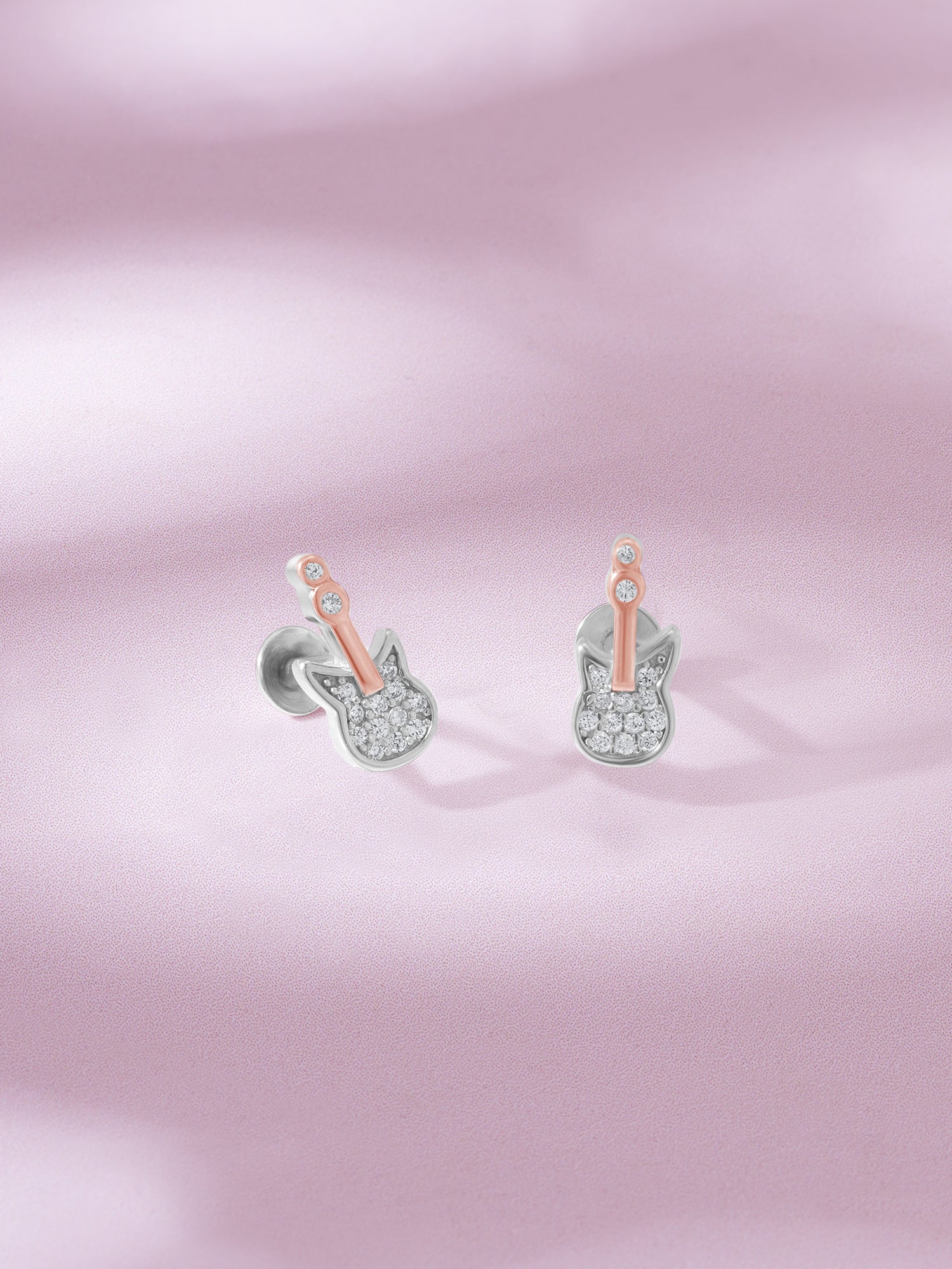Detailed close up of SIJA 925 Silver Guitar Stud showing miniature guitar design and handcrafted silver finish