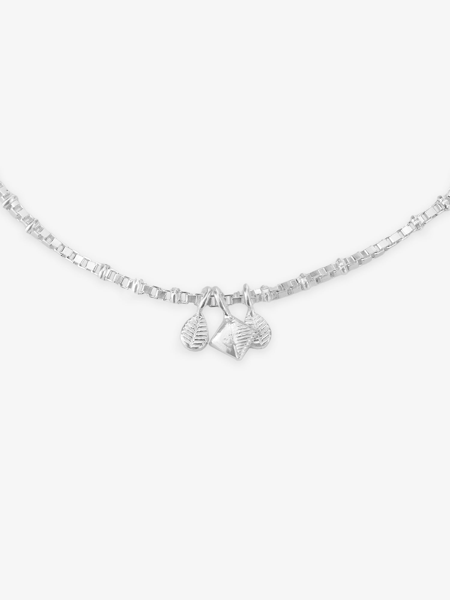 Detailed close up of SIJA 925 Silver Harmony Charm Anklet highlighting delicate harmony charm craftsmanship