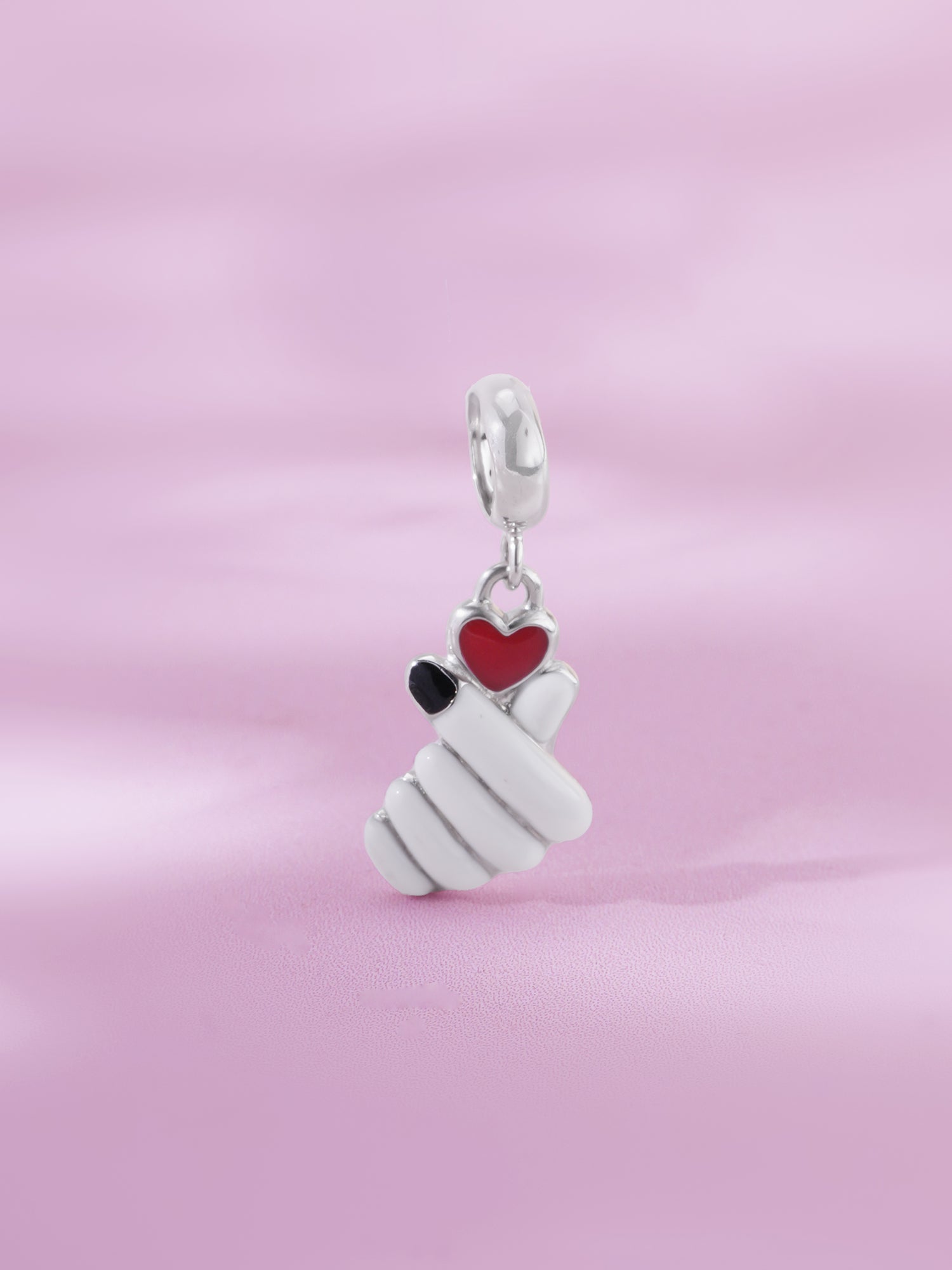 Detailed close up of SIJA 925 Silver Love Charm showing delicate heart design and handcrafted silver finish