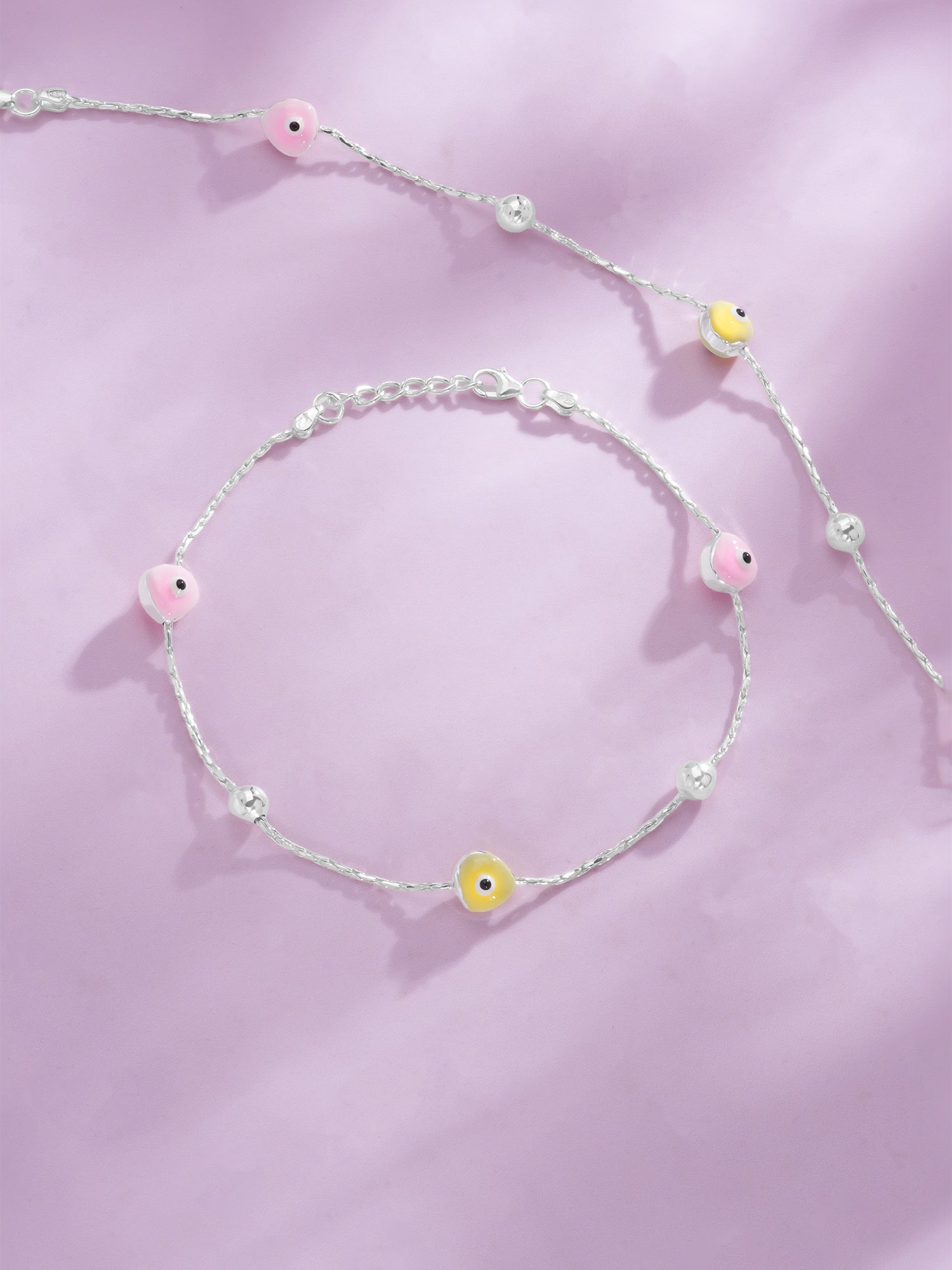 Detailed close up of SIJA 925 Silver Pink and Yellow Beads Glow Anklet showing glowing pink and yellow beads with handcrafted silver finish