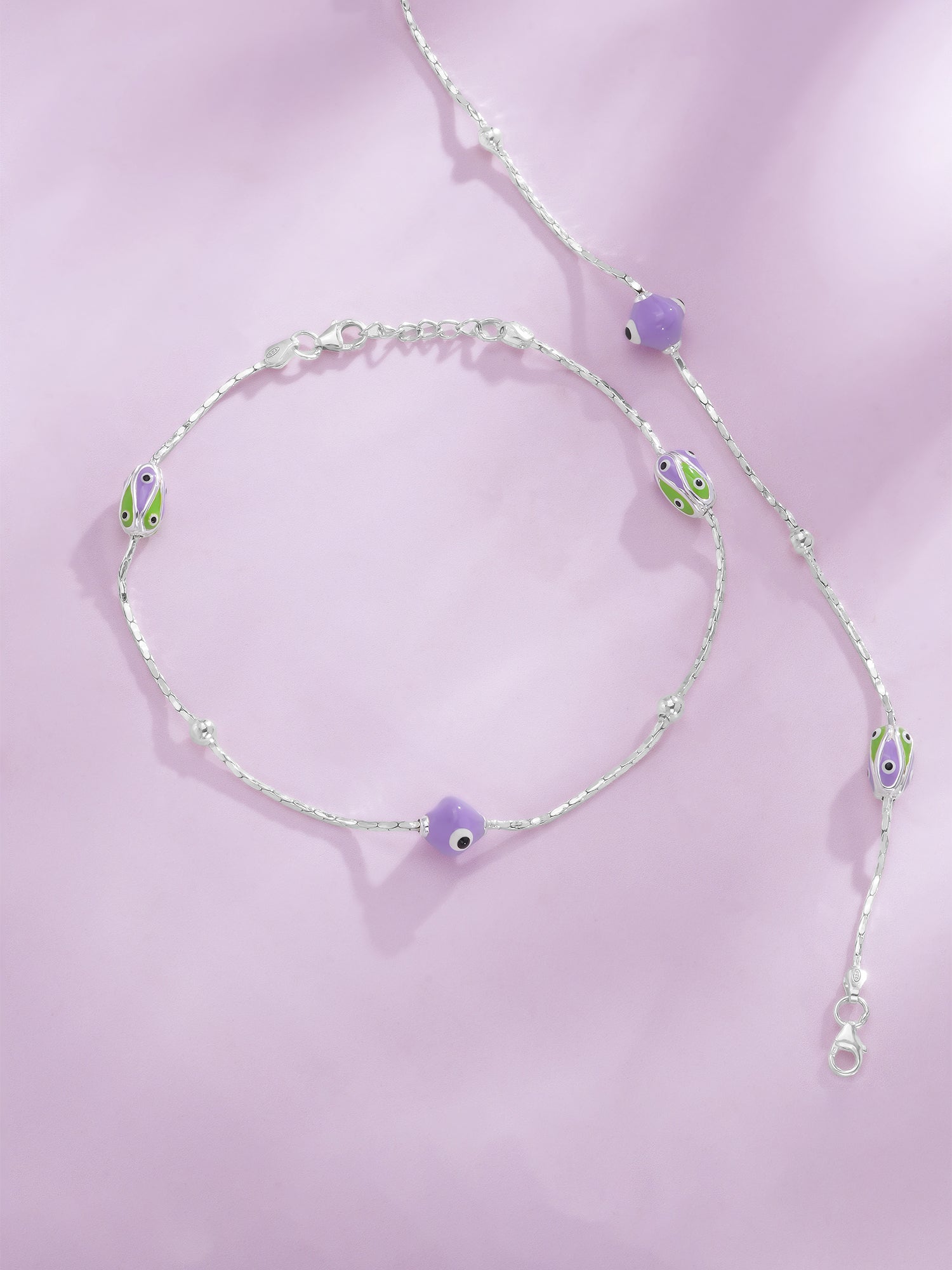 Detailed close up of SIJA 925 Silver Purple and Green Beads Glow Anklet showing glowing purple and green beads with handcrafted silver finish
