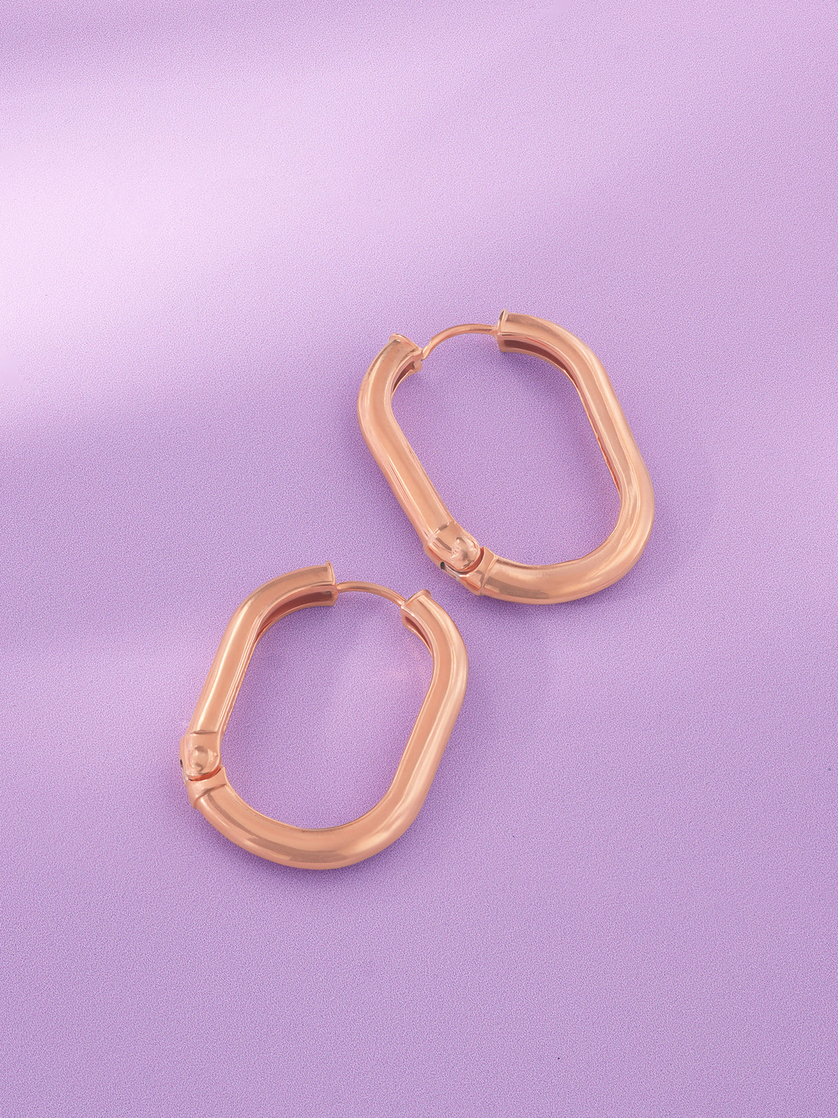 Detailed close up of SIJA 925 Silver Sleek Oval Hoop Earrings showing sleek oval hoop design and handcrafted silver finish