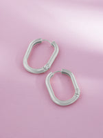 Detailed close up of SIJA 925 Silver Sleek Oval Hoop Earrings showing sleek oval hoop design and handcrafted silver finish