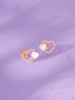 Detailed close up of SIJA 925 Silver Tiny Pearl Heart Stud showing luminous pearl set in delicate heart motif