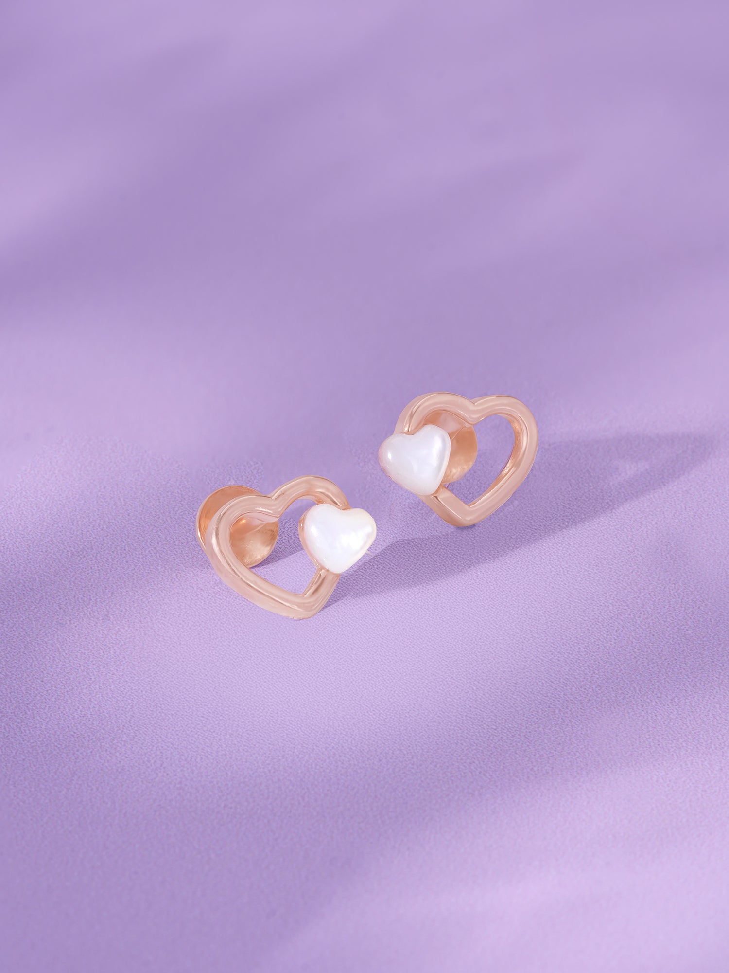 Detailed close up of SIJA 925 Silver Tiny Pearl Heart Stud showing luminous pearl set in delicate heart motif